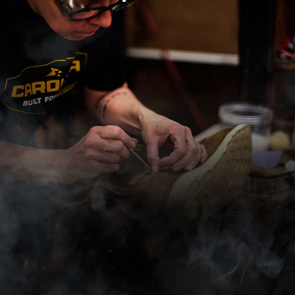 A factory worker making a Carolina boot.