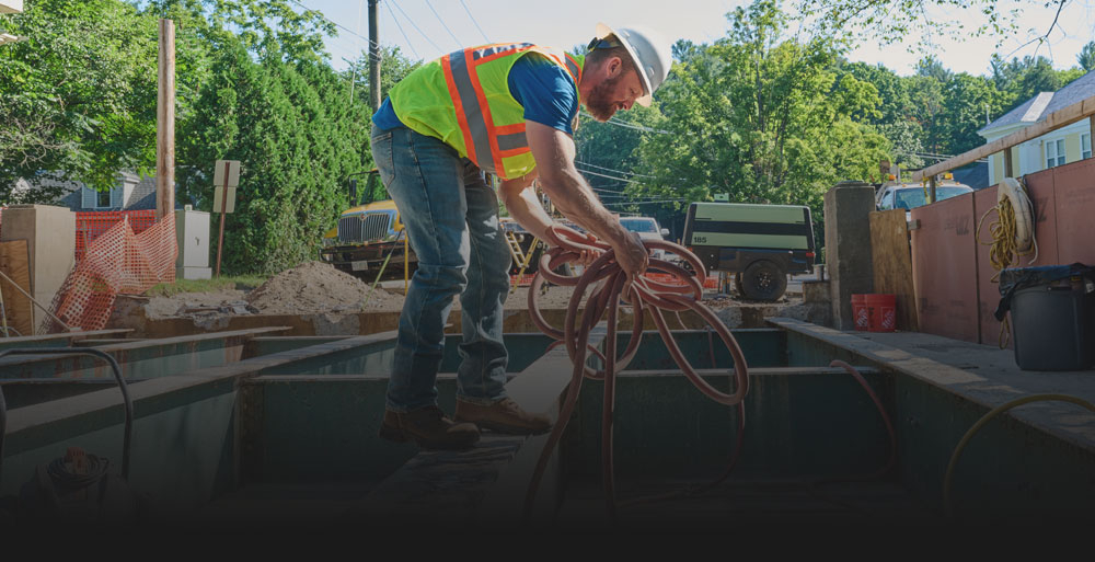 A man working on the job site wearing Gruntz boots.