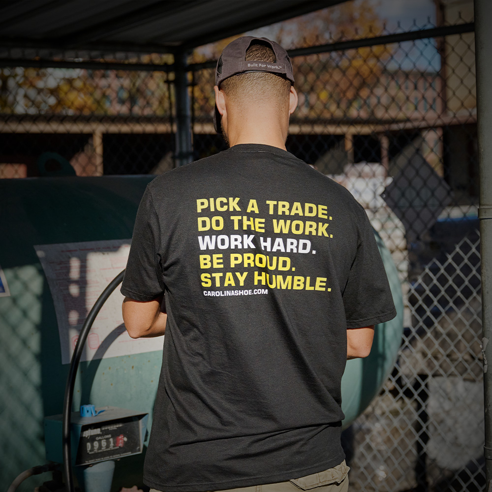 A worker wearing the Cardinal tee in black.