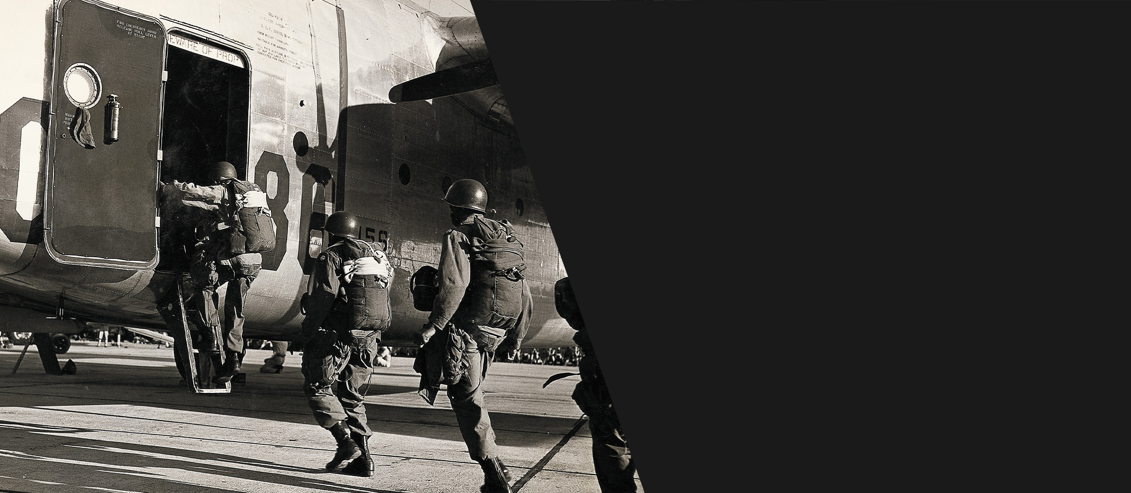 Paratroopers boarding a plane wearing Corcoran boots.