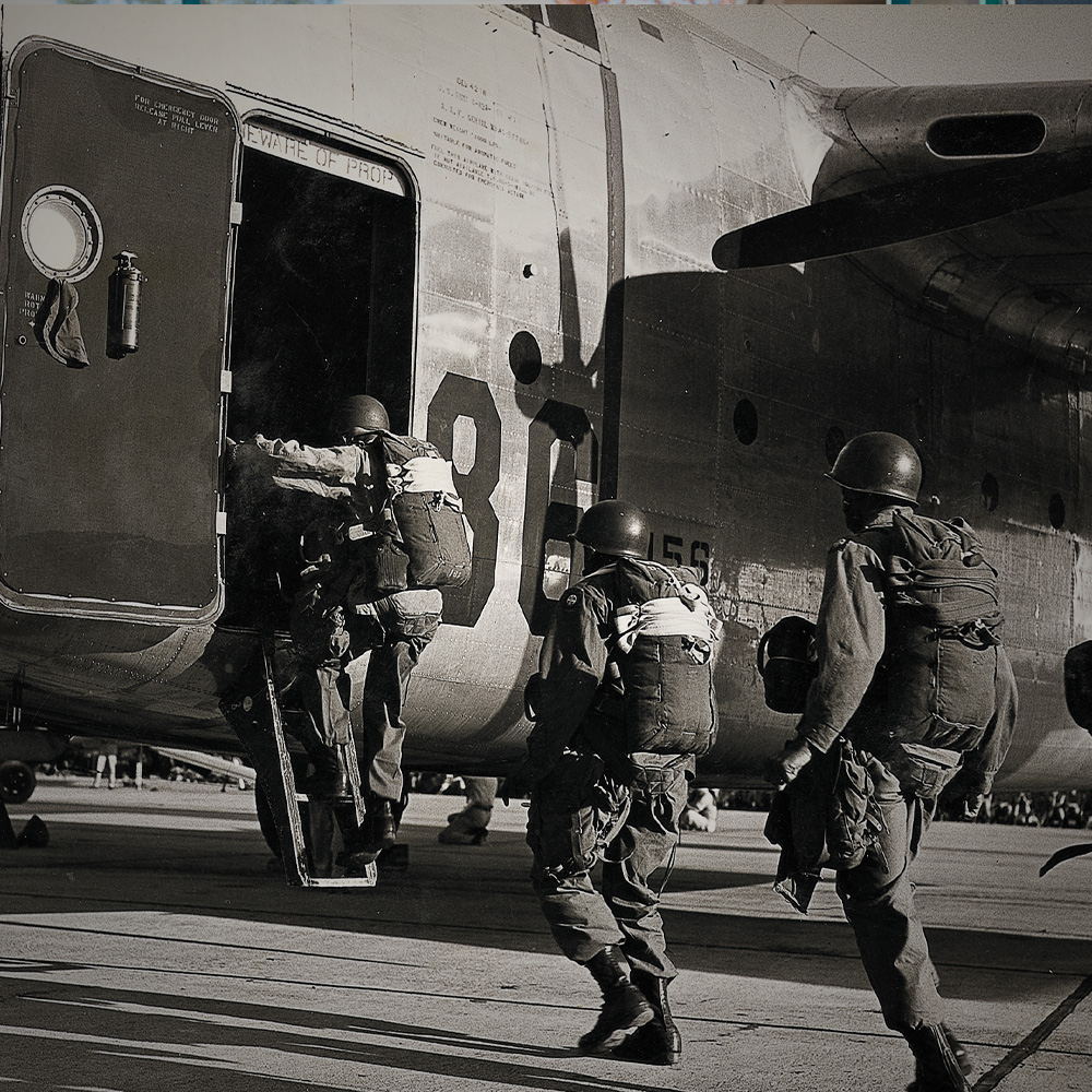 Paratroopers boarding a plane wearing Corcoran boots.